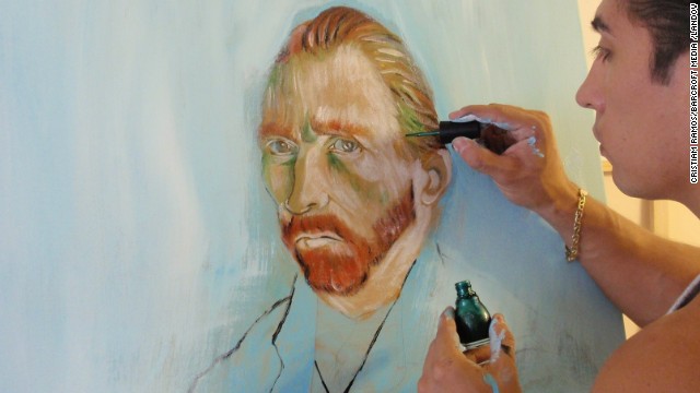 Artist Cristiam Ramos paints a version of van Gogh's self-portrait using nail polish at his studio in Orlando, Florida.