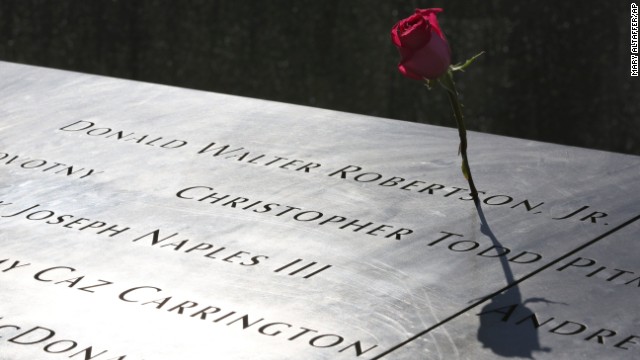 A rose is placed next to the name of a victim of the terrorist attacks on the World Trade Center at the North Pool of the memorial.