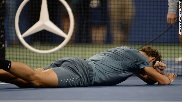 Spain's Rafael Nadal collapses to the ground after winning his second U.S. Open title, September 9, 2013. 