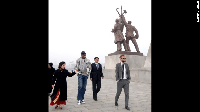 Rodman walks by the base of the Tower of the Juche Idea in Pyongyang in March 2013, in this image released by the Korean Central News Agency.