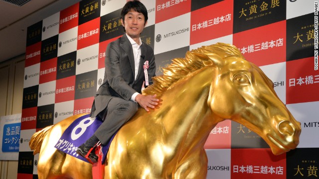 Japan's most famous jockey is Yutaka Take, who has been likened to the David Beckham of his sport. Here the veteran is on board a golden replica of Oguri Cap, which won four Grade One races.