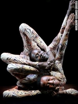 Three years later "Mama Africa" was born, a circus show featuring 50 acrobats, aerialists, clowns, magicians, and of course contortionists. Here, Gitu performs with fellow contortionist Hassan Mohamed in an act called "the Plastic Boys."