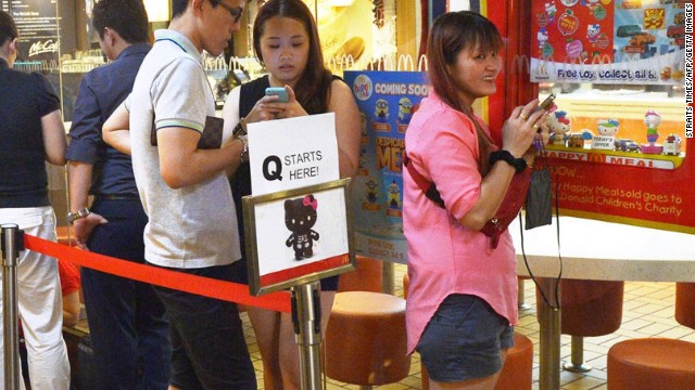 People wait in line to purchase a Hello Kitty toy in a skeleton outfit at a McDonald's restaurant in Singapore. Tempers flared and police had to be called in on June 27 as anxious Singaporeans rushed to McDonald's outlets to buy Hello Kitty plush toys being sold by the chain as a promotion. 