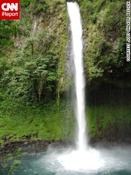 Travelers who make the challenging walk to <a href='http://ireport.cnn.com/docs/DOC-842568'>La Fortuna waterfall</a>, near the base of two volcanoes, are rewarded with the chance to swim in the clear blue pool below.