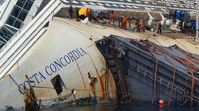 Salvage workers prepare the Costa Concordia cruise ship on August 23, 2013 at Giglio Island. <a href='http://cnn.com/2013/08/22/world/europe/costa-concordia-salvage-interactive/index.html'>The ship will be raised in September </a>near the Italian island where it still lies. The cruise liner made global headlines when it turned on its side after striking rocks on January 13, 2012. 