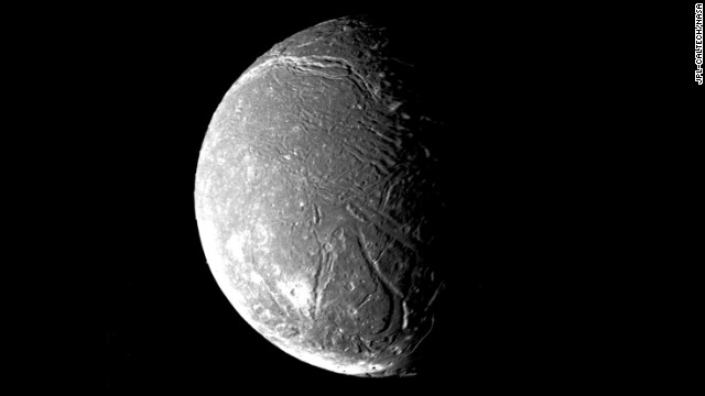 Ariel, another of Uranus' satellite's, shows a densely pitted surface that is also crisscrossed with numerous valleys and fault scarps. 