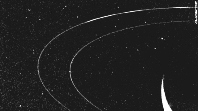 This image of Neptune's outermost ring shows how material clumps into three arcs. 