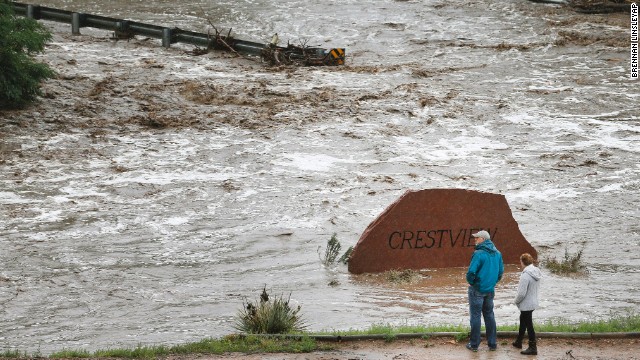 Residents view a road washed out by a torrent of water after overnight flash flooding near Left Hand Canyon, Colorado, on September 12.