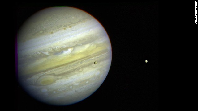 Jupiter, its Great Red Spot and three of its four largest satellites are visible in this photo taken February 5, 1979, by Voyager 1.
