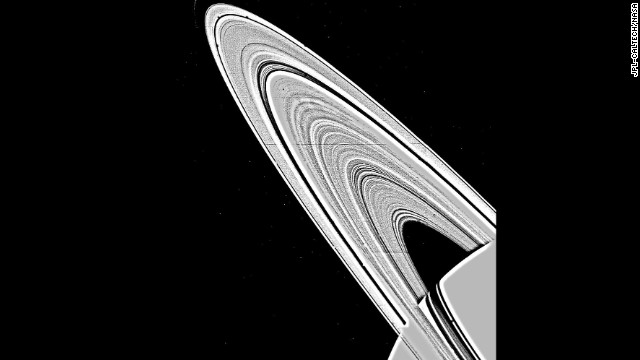 A mosaic image of Saturn's rings, taken by NASA's Voyager 1 on November 6, 1980, shows approximately 95 individual concentric features in the rings. The ring structure was once thought to be produced by the gravitational interaction between Saturn's satellites and the orbit of ring particles, but has now been found to be too complex for this explanation alone.
