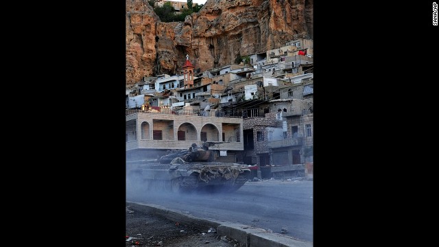 A Syrian government tank is seen during clashes with Free Syrian Army fighters in Maaloula, Syria, on September 11. 