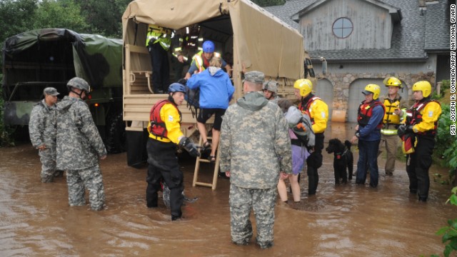 Colorado National Guardsmen assist residents in unincorporated areas of Boulder County, Colorado. Residents were evacuating the area on Thursday, September 12. 