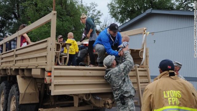 Members of the Colorado National Guard help Boulder County authorities evacuate residents of Lyons, Colorado, to Longmont, Colorado, on Friday, September 13. Flooding has hit the area hard, washing out roads, damaging bridges and destroying homes. 