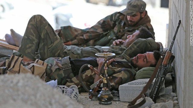 Syria's pro-Assad militia rest near Maalula, Syria, on Friday, September 13.