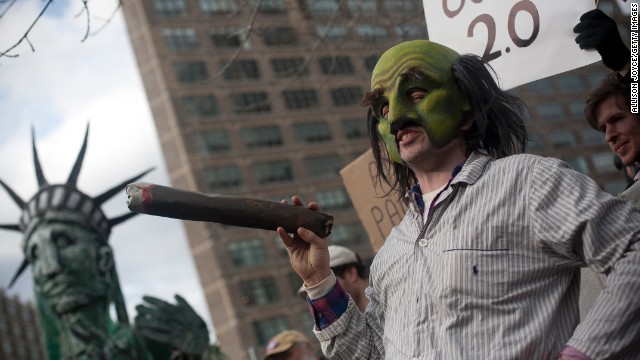 An Occupy Wall Street protester in 2011 stages a play as New York Mayor Michael Bloomberg.