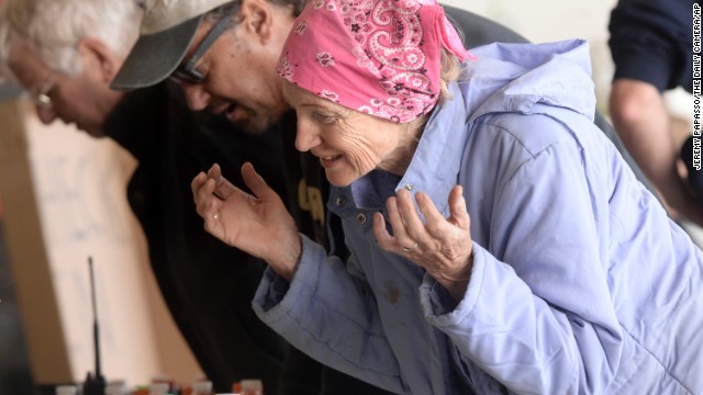 Jerrie McBride checks in with authorities after being rescued by helicopter from the Big Elk Meadows area in Boulder, Colorado, on September 16.