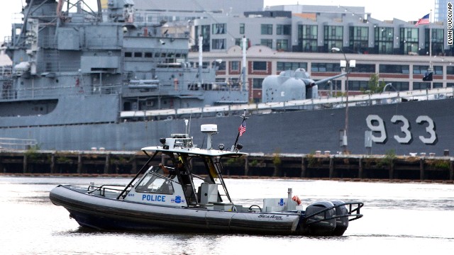 A police boat patrols the waters at the Washington Navy Yard.