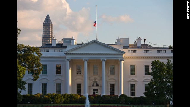 The U.S. flag flies at half-staff above the White House after the deadly shooting.