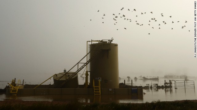 A gas well is surrounded by floodwater near Kersey, Colorado, on September 17. 