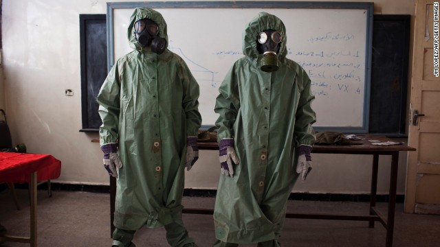 Volunteers wear protective gear to show a class how to respond to a chemical attack in Aleppo, Syria, on September 15. For two months, Mohammad Zayed, an Aleppo University student, has been training a group of 26 civilians to respond to a chemical attack.