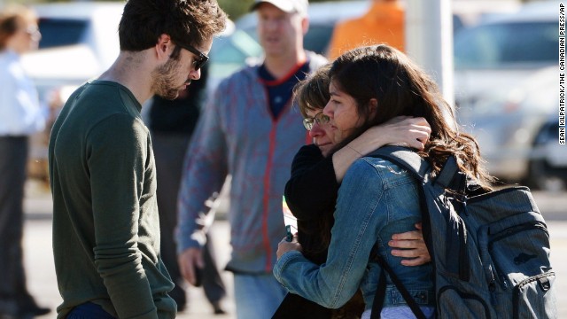 People comfort one another after the crash on September 18.