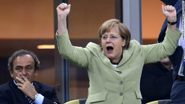 A big football fan, Merkel celebrates <a href='http://worldsport.blogs.cnn.com/2013/05/02/9100/'>Germany scoring a goal against Greece</a> during the Euro 2012 football championships quarter-final match in Gdansk .