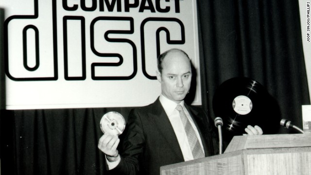 The compact disc (CD) promised high-quality digital sound in a portable optical format. Sales peaked in the late '90s and early 2000s, though it's still prominent today. The disc became a collaboration between Sony and Philips; here, Philips' Joop Sinjou shows his company's version on March 9, 1979.