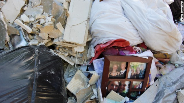 Trash and damaged mementos are piled outside Joan Fishburn's home in Boulder, Colorado, on September 18.