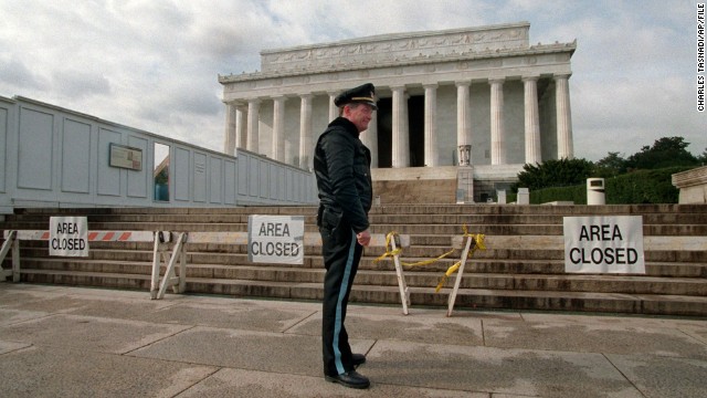 A Park Service police officer stands guard in front of the Lincoln Memorial during a partial shutdown of the federal government in November 1995. Many government services and agencies were closed at the end of 1995 and beginning of 1996 as President Bill Clinton battled a Republican-led Congress over spending levels.