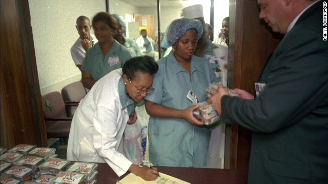 Food service employees at the Veterans Hospital in Miami line up to receive food rations on January 3, 1996. Many federal employees faced financial hardships during the shutdown.