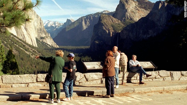Tourists view Yosemite National Park in California after it re-opened on January 6, 1996. Early that morning, President Clinton signed Republican-crafted legislation to restore jobs and provide retroactive pay to government workers while he and Congress continued negotiating how to balance the federal budget.