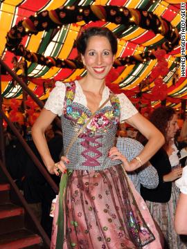 A tent isn't just a tent at Oktoberfest, but a sign of your personality type. Celebrities of various grades gather at the Hippodrom tent -- here a German designer of trad Bavarian wears what looks like a floral spaceship landing on her head. 