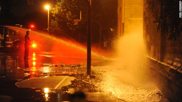 The Chicago Fire Department hoses down the scene where the shooting occurred.