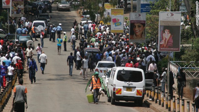 Crowds gather outside the upscale shopping mall. The interior ministry urges Kenyans to keep off the roads near the mall so police can ensure everyone inside has been evacuated to safety. 