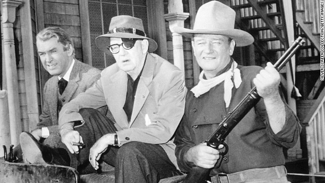 Jimmy Stewart, director John Ford and John Wayne appear on the set of 'The Man Who Shot Liberty Valance' in 1962. 