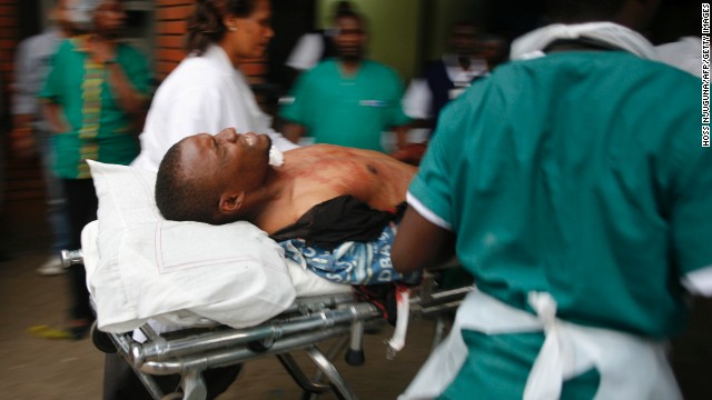 An injured man is wheeled into the Aga Khan Hospital in Nairobi.