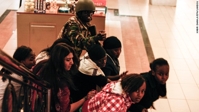 A soldier directs people up a stairway inside the Westgate on September 21.