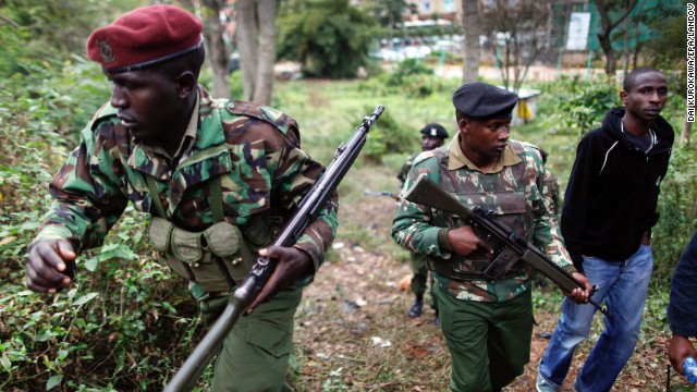 Kenyan paramilitary police officers patrol the area near the Westgate Mall in Nairobi, Kenya, where hostages are being held for the second day on Sunday, September 22. Gunmen burst into the mall and opened fire in a deadly attack on September 21. Kenyan government and Western diplomatic sources said Al-Shabaab militants were holding about 30 hostages inside the shopping center on Sunday. As grim-faced Kenyan soldiers warily searched the five-story building -- and as Al-Shabaab maintained its defiant stance -- the siege was no closer to a resolution. 