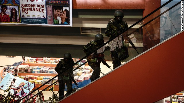 Soldiers move up stairs inside the Westgate Mall.