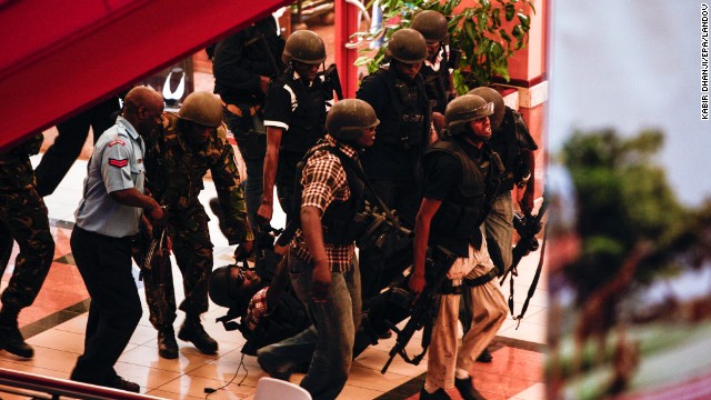 Officials carry an injured man in the mall.