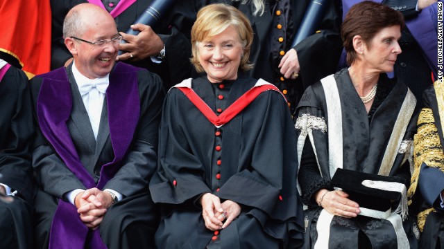 Clinton poses for pictures at St. Andrews University in St. Andrews, Scotland, on September 13. Clinton received an honorary degree from the university.