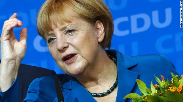 German Chancellor Angela Merkel addresses supporters at the party headquarters in Berlin on Sunday, September 22, 2013, after securing a third consecutive term as chancellor. 