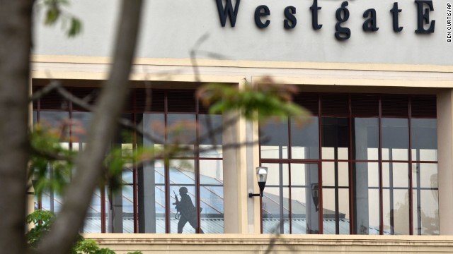 A Kenyan soldier runs through a corridor on an upper floor at the Westgate Shopping Mall in Nairobi, Kenya, on Tuesday, September 24, shortly before an explosion was heard. Sounds of heavy gunfire erupted from the mall Tuesday, even as authorities said they had the building under their control. But four days after Al-Shabaab terrorists stormed the swanky mall, several gunmen -- including snipers -- were still inside, two senior officials said.