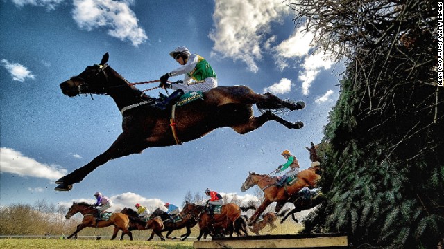 Aintree, Liverpool, UK: Horses and jockeys negotiate the famous Bechers Brook fence during The John Smith's Foxhunters Steeple Chase. Crowhust took four cameras to Aintree in April, this year. "I had three remote cameras and one in hand which sets off the other three. They're only jumping once, so you've got to make the most of the oportunity," he says. "You get nice shapes in jumping as well when (the horses) stretch." 