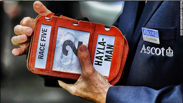 Royal Ascot, Ascot, Berkshire, UK: Everything is on Crowhurst's radar. A steward clasps stable lad's armbands. 