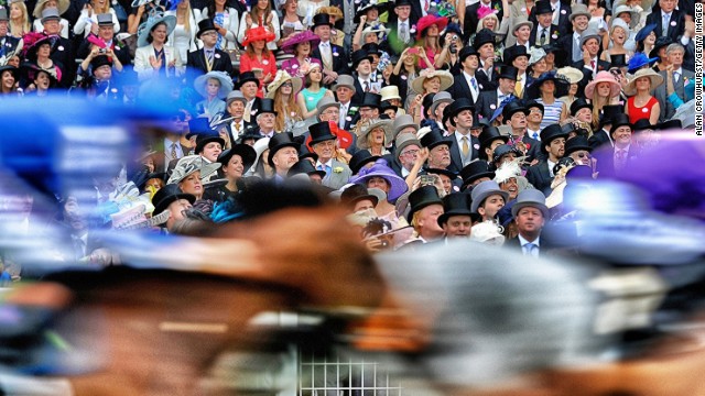 Royal Ascot, Ascot, Berkshire, UK: Runners pass the grandstand in the Ascot Stakes during day one of Royal Ascot. "You can't really go too far wrong. It's always nice colors, smart clothing," added Crowhurst. 