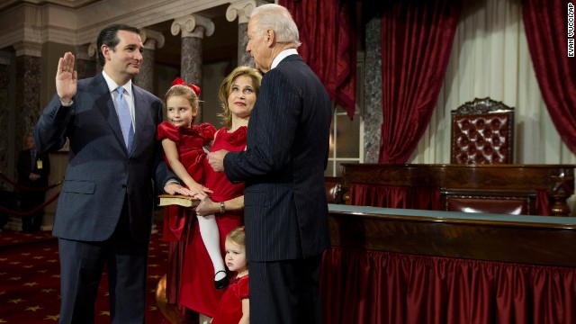 Vice President Joe Biden administers the Senate oath to Cruz during a mock swearing-in ceremony January 3 in Washington. Cruz was accompanied by his wife, Heidi Nelson, and his daughters Caroline and Catherine.