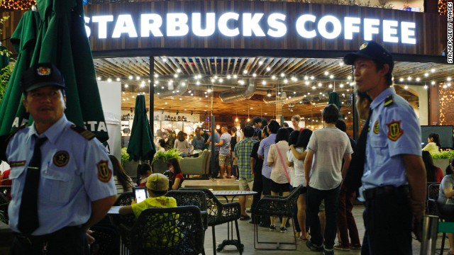 Even in Vietnam, a global coffee capital, customers lined up to be the first to hold a cup sporting the iconic twin-tailed mermaid on the opening day of the first Starbucks outlet in Ho Chi Minh City in February 2013. 