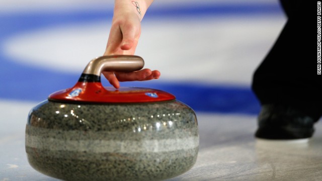 The curling stone is made of Scottish granite and slid along the ice, usually with one to three rotations in its trajectory to curve it past what are known as guarding stones as teams battle for position.