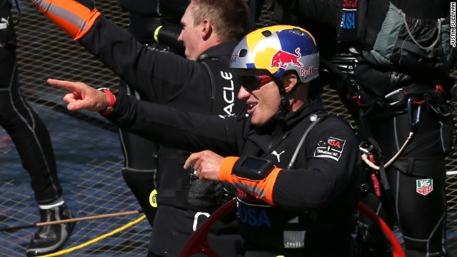 Oracle Team USA skipper Jimmy Spithill celebrates the victory following the race's dramatic conclusion.